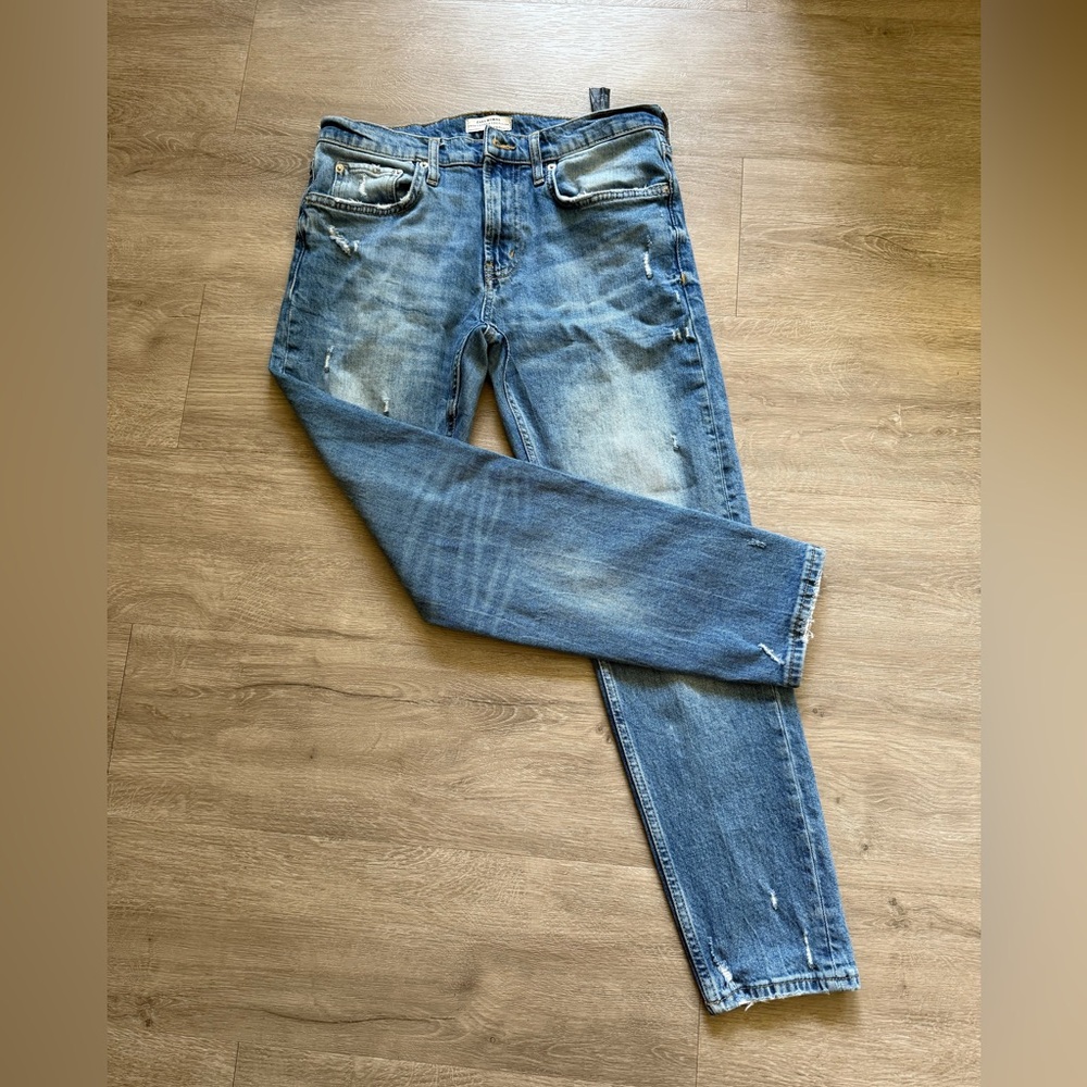 32. Zara Blue Slim Jeans with Distressed Details